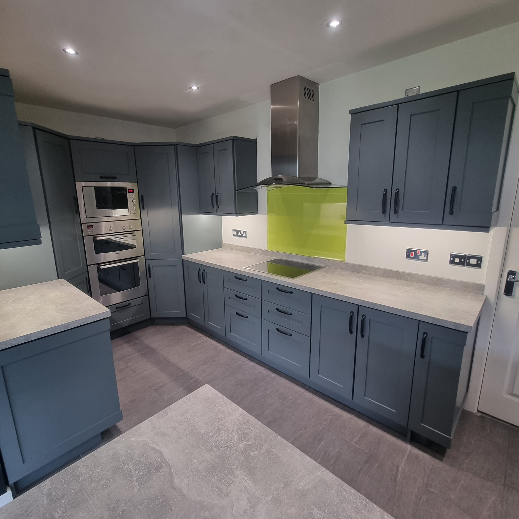 Kitchen cupboard spraying in Antrim with modern colours and factory-style finishes.